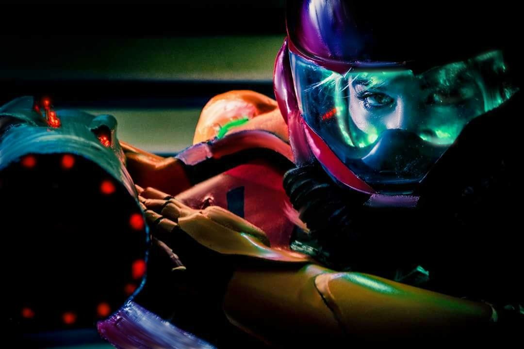 Ash Vickey in a full Samus Aran power suit cosplay